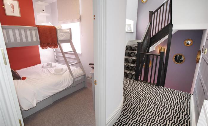 single over and double under bunkbed. TV. situated on the first floor.